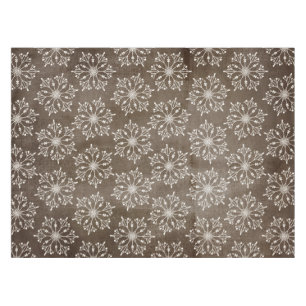 White Snowflakes on Brown Tablecloth