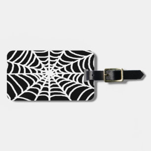 white spider web luggage tag