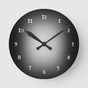 White spotlight on black round clock