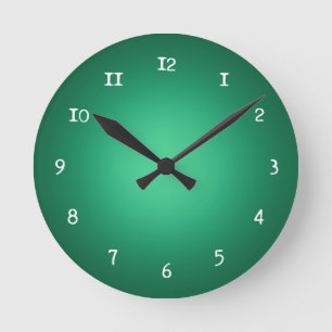 White spotlight on green round clock