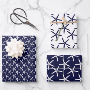 White starfish on a navy blue background wrapping paper sheet