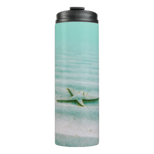 White starfish on sand underwater in the morning thermal tumbler