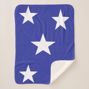 White stars on blue sherpa blanket