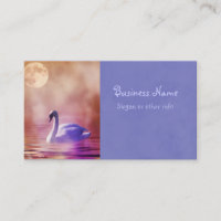 White Swan floating on a misty lake