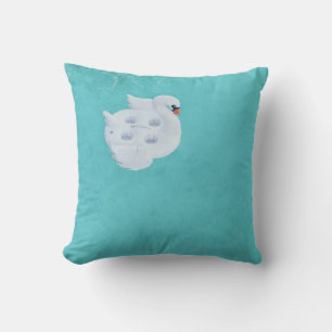 White swan inflatable on body of water cushion