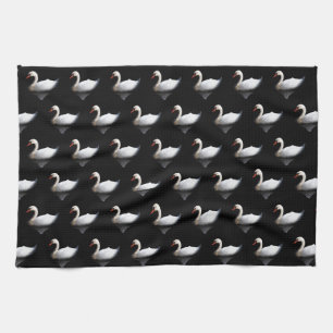 White swan on black tea towel