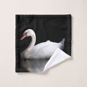White swan on black wash cloth