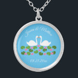 White Swans and Water lilies Wedding Custom Silver Plated Necklace<br><div class="desc">This beautiful Wedding necklace features a digital art image of a pair of beautiful white swans with orange becks facing each other looking like they are kissing. Underneath the swans is a group of pretty pink water lily flowers with yellow centres and green lily pads. A beautiful wedding design. There...</div>