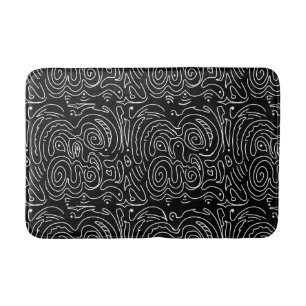 White swirly lines on black bath mat