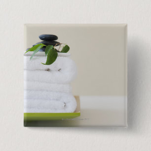 White towels and spa stones 15 cm square badge