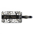 White tropical flowers on black