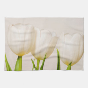 White tulips against a white background, tea towel