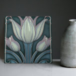 White Tulips on Blue Symmetric Art Nouveau Ceramic Tile<br><div class="desc">Welcome to CreaTile! Here you will find handmade tile designs that I have personally crafted and vintage ceramic and porcelain clay tiles, whether stained or natural. I love to design tile and ceramic products, hoping to give you a way to transform your home into something you enjoy visiting again and...</div>