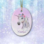 White Unicorn Floral Believe Ceramic Ornament<br><div class="desc">A beautiful white unicorn is decorated with pink and blue flowers, and rises out of fluffy white clouds on this pretty ornament for her. The unicorn image is placed on a gradient pink lavender background with scattered distant stars. At the bottom is her name in darker lavender. The back of...</div>