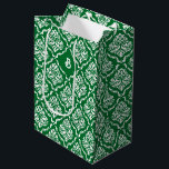 White vintage damasks pattern on Christmas green Medium Gift Bag<br><div class="desc">White vintage floral damask in a seamless pattern on a Christmas green background. The dark green background can be changed to any colour against the white damask to match the colours you need for your event.
Customisable one-letter monogram.</div>