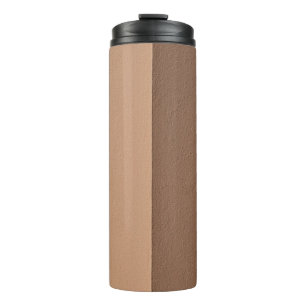 White wall paint beside white wall thermal tumbler