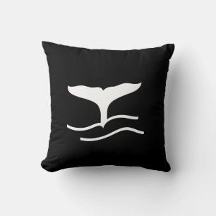 white whale tail on teal blue pillow