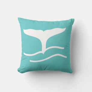 white whale tail on teal blue pillow