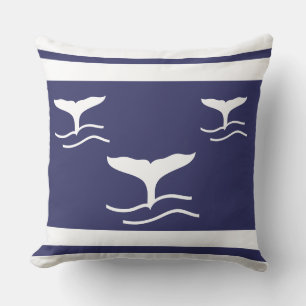 white whale tails on navy blue pillow