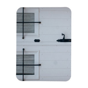 White Wooden Door With Black Wrought Iron Works Magnet