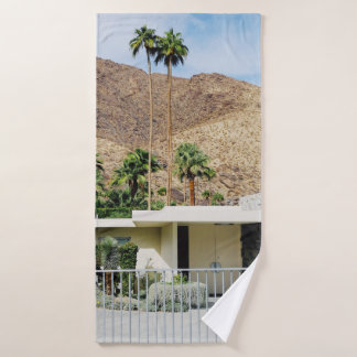 WHITE WOODEN FENCE NEAR GREEN PALM TREE DURING DAY BATH TOWEL