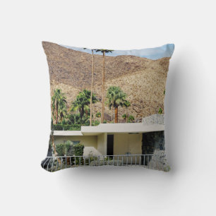 WHITE WOODEN FENCE NEAR GREEN PALM TREE DURING DAY CUSHION