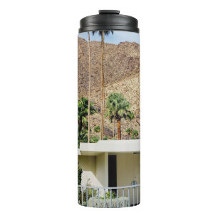 WHITE WOODEN FENCE NEAR GREEN PALM TREE DURING DAY THERMAL TUMBLER