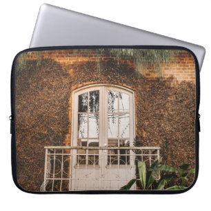 WHITE WOODEN WINDOW FRAME ON BROWN CONCRETE WALL LAPTOP SLEEVE