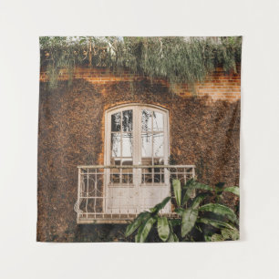 WHITE WOODEN WINDOW FRAME ON BROWN CONCRETE WALL TAPESTRY