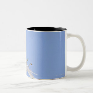 Whooper Swans flying in the sky Two-Tone Coffee Mug