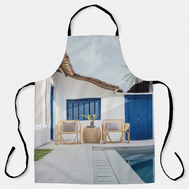 Wicker table and two chairs near swimming pool apron (Front)