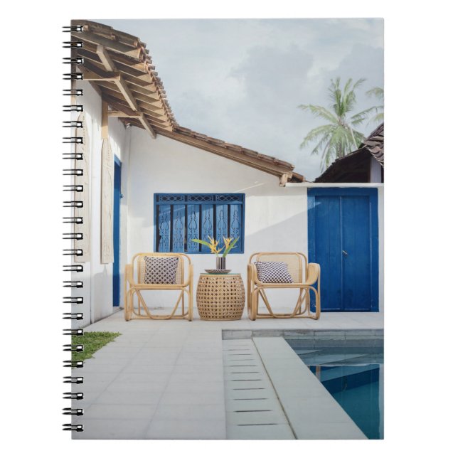Wicker table and two chairs near swimming pool notebook (Front)