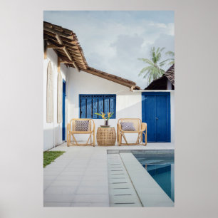 Wicker table and two chairs near swimming pool poster