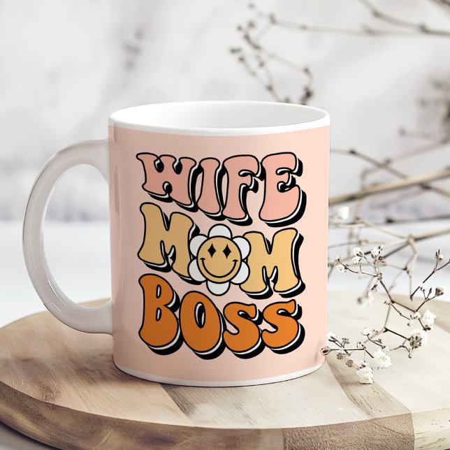 "Wife Mum Boss" Blush Pink Groovy Retro Coffee Mug ("Wife Mom Boss" Blush Pink Groovy Retro Coffee Mug on a boho wooden kitchen table.)