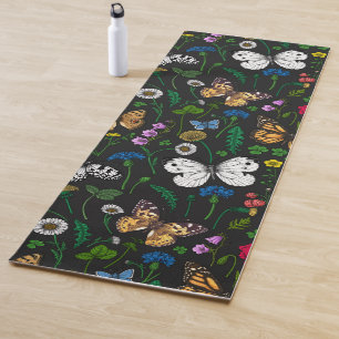 Wild flowers and butterflies on black yoga mat