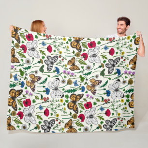 Wild flowers and butterflies on white fleece blanket