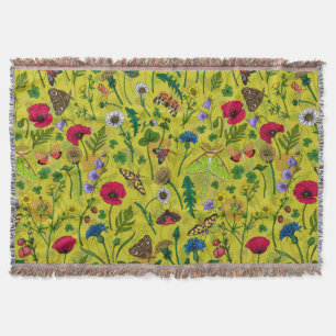 Wild flowers and moths on green throw blanket
