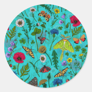 Wild flowers and moths on teal classic round sticker