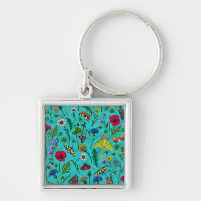Wild flowers and moths on teal key ring (Front)