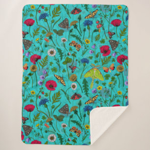Wild flowers and moths on teal sherpa blanket