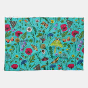 Wild flowers and moths on teal tea towel