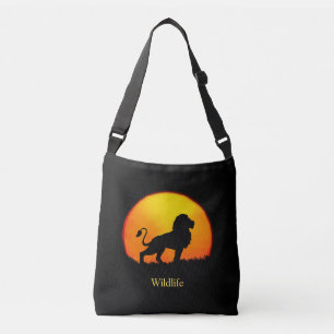 Wild lion & sunrise on the jungle crossbody bag