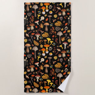 Wild mushrooms on black beach towel