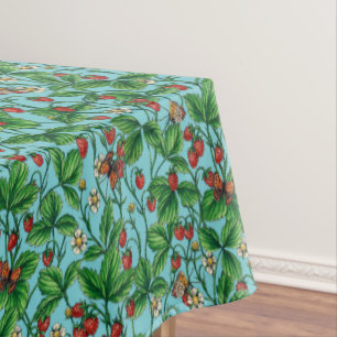 Wild strawberries on pool blue tablecloth