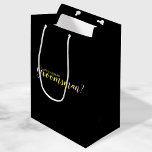 Will You Be My Groomsman? Modern Proposal Medium Gift Bag<br><div class="desc">"Will You Be My Groomsman?"Modern Proposal Gift Bag
features title "Will You Be My Groomsman?" in gold modern script font style on black background.

Please Note: The foil details are simulated in the artwork. No actual foil will be used in the making of this product.</div>