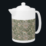 William Morris Vintage Windrush Flowers Foliage<br><div class="desc">William Morris Vintage Windrush Flowers Foliage Teapot -  Decorating this product is Windrush,  a design created by William Morris in 1890 and named after River Windrush,  a tributary of the Thames – The pattern is a beautiful work of art featuring large flower-heads criss-crossing with smaller undergrowth and scrolling foliage.</div>