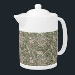William Morris Vintage Windrush Flowers Foliage<br><div class="desc">William Morris Vintage Windrush Flowers Foliage Teapot -  Decorating this product is Windrush,  a design created by William Morris in 1890 and named after River Windrush,  a tributary of the Thames – The pattern is a beautiful work of art featuring large flower-heads criss-crossing with smaller undergrowth and scrolling foliage.</div>