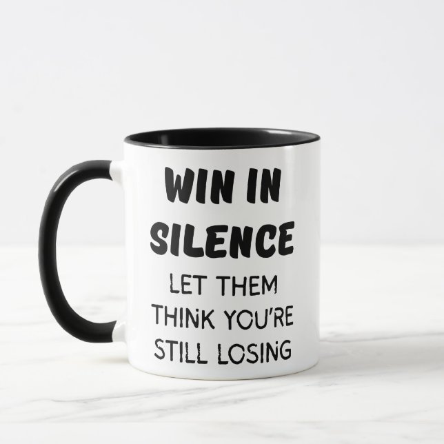 WIN IN SILENCE LET THME THINK YOU'RE STILL LOSING MUG (Left)