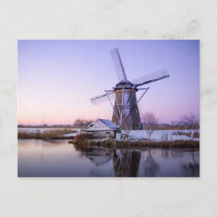 Windmill during sunrise, Holland winter postcard