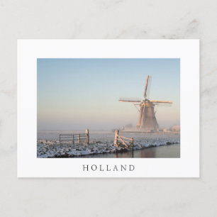 Windmill in the snow at sunrise postcard with text